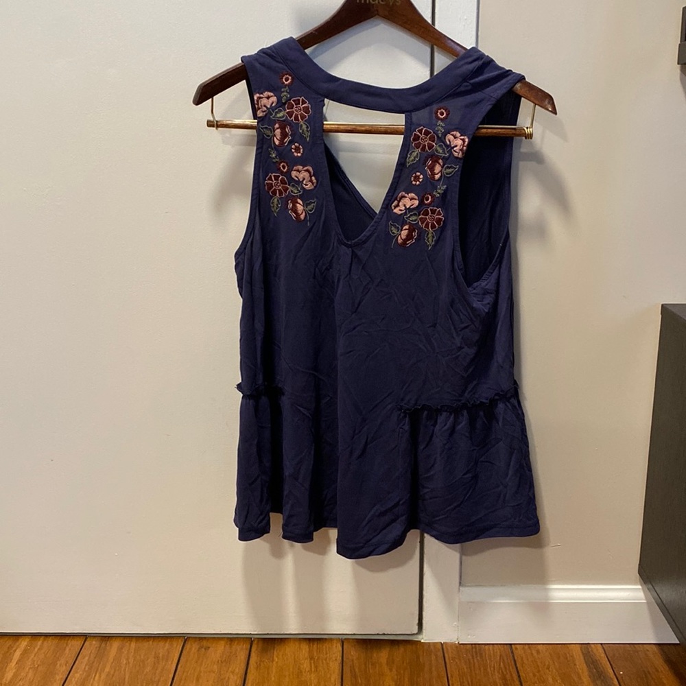 Blue tank with beautiful floral pattern on front